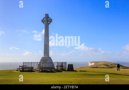 The Tennyson Memorial erecterd in 1897 on Tennyson Down in the Needles Country Park, Freshwater, Isle of Wight, southern England, against a blue sky Stock Photo