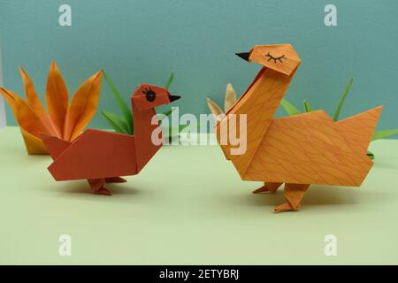 Origami geese made out of brown paper. Stock Photo