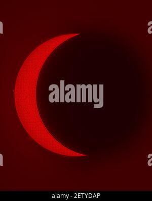 A view of the Sun during a Partial Solar Eclipse, an amazing view of our star shining in H Alpha light. An awe view of the astronomical evento from Sa Stock Photo