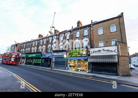 London/UK - 02/15/21 - A line of shops on Hoe Street in Walthamstow Stock Photo