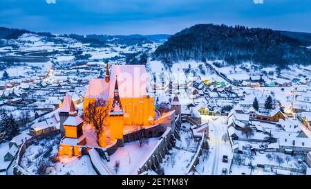 Biertan, Romania. Medieval saxon village in Transylvania, frozen winter night. Stock Photo