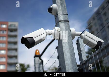 Video surveillance CCTV cameras used for security of car park or building Stock Photo