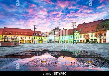 Sibiu, Romania. Colorful clouds on sunrise, Large Square in Sibiu, Transylvania. Stock Photo
