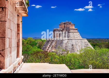 Uxmal, Mexico. Pyramid of the Magician in ancient jungle Mayan city Uxmal, Yucatan Peninsula. Stock Photo