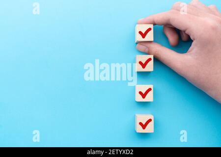 Red tick marking on checklist Stock Photo