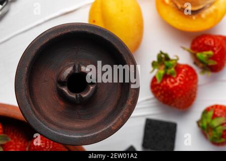 Empty hookah shaft close up on table with fresh fruit Stock Photo