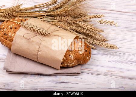 One loaf of freshly baked buckwheat bread in a paper bag isolated. Stock Photo