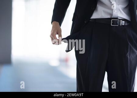 Mid section of businessman showing empty pockets Stock Photo