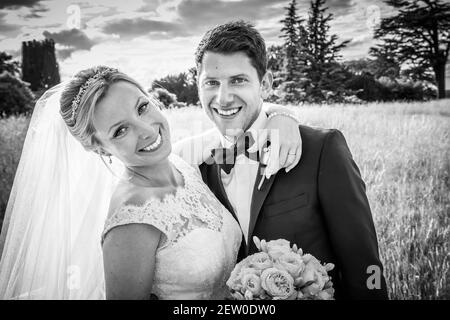Bride and Bridegroom looking very happy and in love on their wedding day Stock Photo