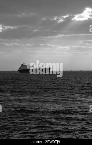 Bulk Carrier ship and sunlight beams Stock Photo