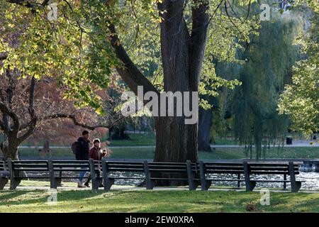A couple walking in Boston Public Garden Stock Photo