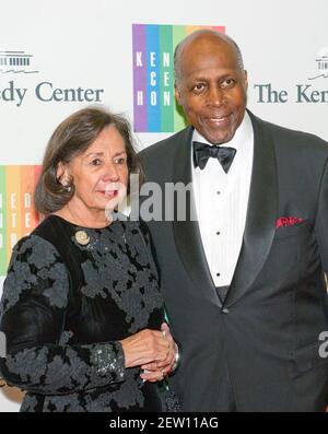 Vernon Jordan and his wife, Ann, arrive for the formal Artist's Dinner honoring the recipients of the 2013 Kennedy Center Honors hosted by United States Secretary of State John F. Kerry at the U.S. Department of State in Washington, DC on Saturday, December 7, 2013. The 2013 honorees are: opera singer Martina Arroyo; pianist, keyboardist, bandleader and composer Herbie Hancock; pianist, singer and songwriter Billy Joel; actress Shirley MacLaine; and musician and songwriter Carlos Santana.Credit: Ron Sachs/CNP /MediaPunch Stock Photo