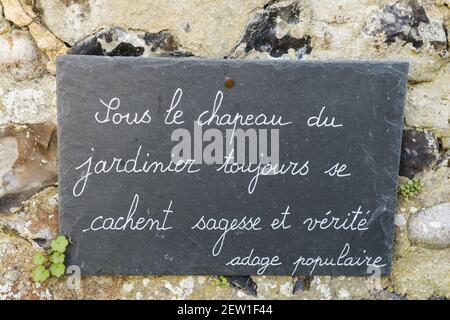 France, Somme, Baie de Somme, Saint Valery sur Somme, the Herbarium is a medieval garden classified Remarkable Garden restored and maintained by an association since 1995, quote and philosophical thought on a slate in the garden Stock Photo