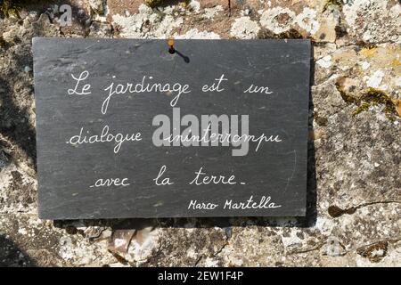 France, Somme, Baie de Somme, Saint Valery sur Somme, the Herbarium is a medieval garden classified Remarkable Garden restored and maintained by an association since 1995, quote and philosophical thought on a slate in the garden Stock Photo