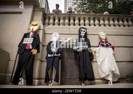 Puppets depicting U.S. President Donald Trump, Vice President Mike Pence, and U.S. Attorney General Jeff Sessions rest against a wall during a rally in downtown Chicago, IL one day after white nationalists attacked counter-protestors in Charlottesville, VA. Sunday August 13, 2017. Photographer: Christopher Dilts/Sipa USA *** Please Use Credit from Credit Field ***