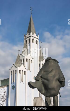 Statue to Istvan Szechenyi famous hungarian statesman, lived in the 19th century in Heviz village, On the background  Modern Szentlelek Holy Spirit ch Stock Photo