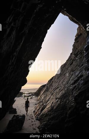 France, Cotes d'Armor, Plérin, young woman bathing at sunrise at Martin plage Stock Photo