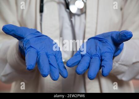 Doctor's hands in blue medical gloves. Medicine. Stock Photo