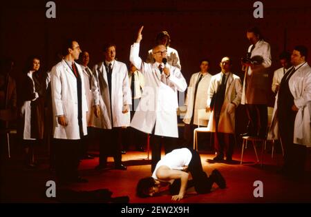 centre: Russell Enoch (Dr Brodsky), Phil Daniels (Alex) in A CLOCKWORK ORANGE 2004 at the Barbican Theatre, London EC2  06/02/1990  a Royal Shakespeare Company production  written by Anthony Burgess in collaboration with Ron Daniels  music by The Edge & Bono  design: Richard Hudson  lighting: David Hersey  choreography: Arlene Phillips  fights: Malcolm Ranson  director: Ron Daniels Stock Photo