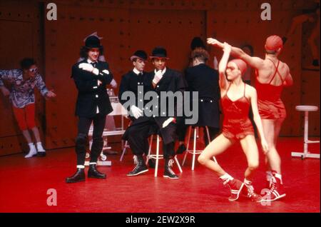 centre: 3 Droogs, l-r: Phil Daniels (Alex), John Hannah (George), Francis Mark Johnson (Pete) in A CLOCKWORK ORANGE 2004 at the Barbican Theatre, London EC2  06/02/1990  a Royal Shakespeare Company production  written by Anthony Burgess in collaboration with Ron Daniels  music by The Edge & Bono  design: Richard Hudson  lighting: David Hersey  choreography: Arlene Phillips  fights: Malcolm Ranson  director: Ron Daniels Stock Photo