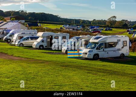 Caravans and Camper vans at the campsite at Three Cliffs Bay on the south coast of the Gower Peninsula near Swansea in South Wales UK Stock Photo