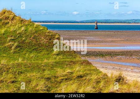 View over Whiteford Sands towards the cast iron Whiteford Lighthouse  the most northerly beach on the Gower Peninsula near Swansea in South Wales UK Stock Photo