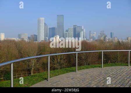 ROTHERHITHE, LONDON - 2ND MARCH 2021: A cityscape view of the Canary Wharf skyline from Stave Hill Ecological Park. Photographed on a sunny day. Stock Photo