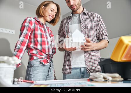 Building designers involved in scale model study Stock Photo