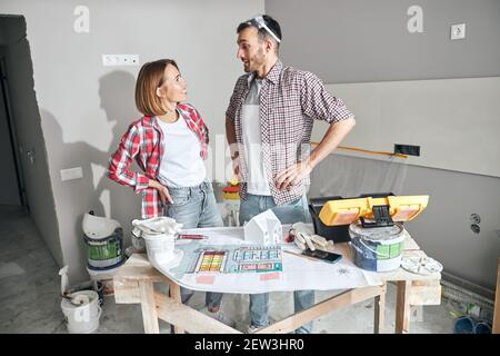 Two young architects in casual clothes staring at each other Stock Photo