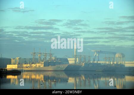 Decommissioned USN ships dockside in Philadelphia with others in the backround Stock Photo