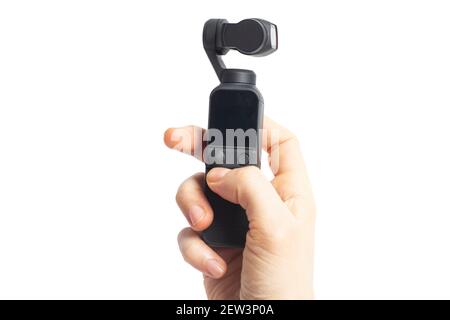 Hand hold action camera isolated on white background. Stock Photo
