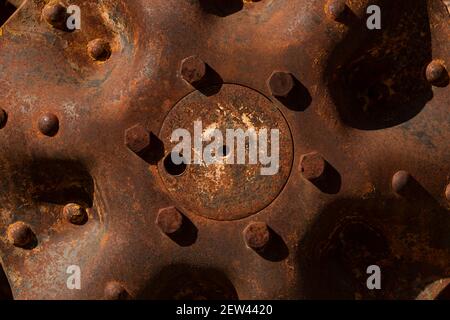 Rusty metal parts belonging to an old abandoned and disused tractor, formerly used in the agronomic industry, near Campo de Borja, Zaragoza province, Stock Photo
