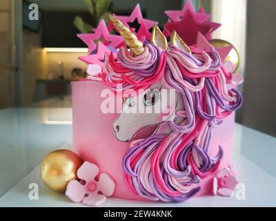 The concept of a festive dessert for children on their birthday in the form of a fantastic unicorn.Texture or background Stock Photo