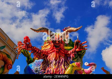 Putignano, Apulia, Italy - February 15, 2015: carnival floats, giant paper mache. Carnival of Putignano: allegorical float of deadly sins. Stock Photo