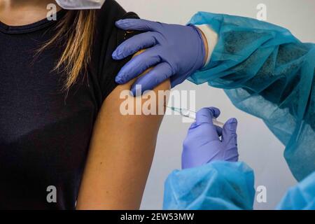 Munich, Bavaria, Germany. 2nd Mar, 2021. The administration of the AstraZeneca Covid vaccine to Munich Police. Starting with some 10,000 doses of the AstraZeneca Covid-19 vaccine, the Bavarian Police has begun vaccinating its Bereitschaftspolizei and Einsatzeinheiten- specialized police units that deal with demonstrations, riots, and other missions. Germany's vaccine program has been criticized for being extremely slow, with numerous nations surpassing not only percentage of the population vaccinated, but also absolute numbers as they vaccinate those at risk and simultaneously the general Stock Photo