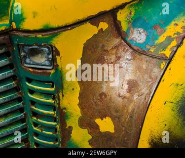 yellow and green pain peeling off the rusted metal grill of the famous magic 142 bus from 'Into the wild' fame Stock Photo