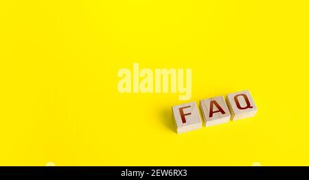 Blocks with the word abbreviation FAQ (frequently asked questions) on a yellow background. Answers explanations for users and customers. Instructions Stock Photo