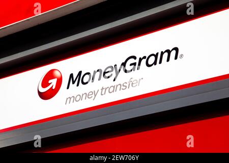 Sign for MoneyGram on a shop front - international money transfer company, London, UK Stock Photo