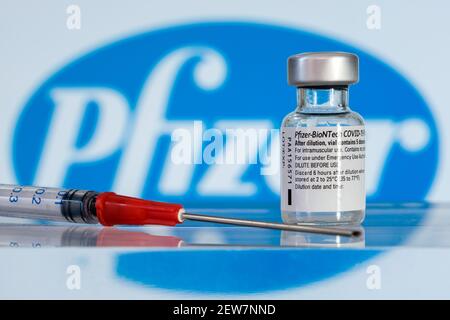 Montreal, CA - 2 March 2021: Vial of Pfizer BioNTech Covid-19 vaccine and logo Stock Photo
