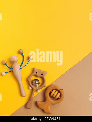 Children's wooden toys, rattles and teethers. Copy space. Stock Photo