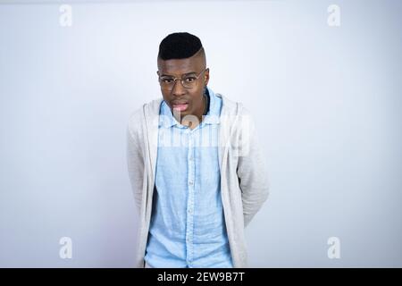 Young handsome african american man wearing casual clothes afraid and shocked with surprise and amazed expression, fear and excited face. Stock Photo