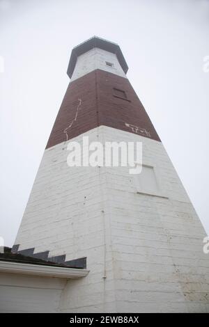 An upward view of the Montauk Point Lighthouse tower in Montauk NY on the South Fork of Long island Stock Photo
