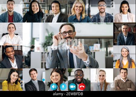 Webcam computer screen view at multiracial diverse business people group, involved in video conference, online meeting, using video call app, virtual online briefing concept Stock Photo