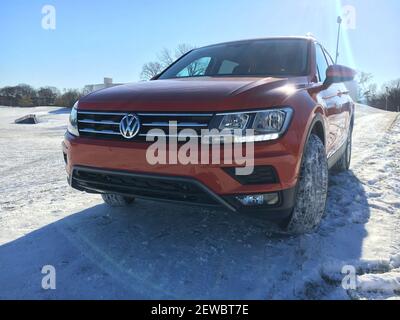 The 2018 Volkswagen Tiguan SE with AWD in Habanero Orange paint coat is powered by a revised 2-liter turbocharged 4-cylinder engine with variable valve timing. It's longer and heavier than the outgoing model, yet more fuel efficient and powerful. The compact crossover is pictured December 30, 2017, in Arlington Heights, Ill. (Photo by Robert Duffer/Chicago Tribune/TNS/Sipa USA)