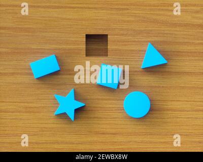 Assorted blue building blocks on wooden table. Concept image of educational toy and psychological test. Stock Photo