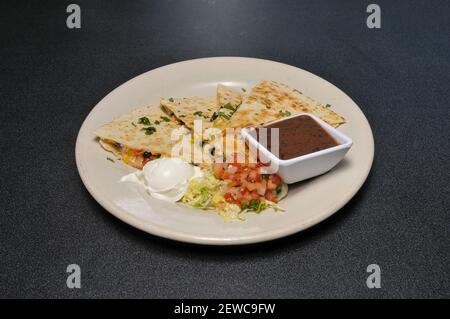The mexican delicacy known as a black bean quesadilla Stock Photo
