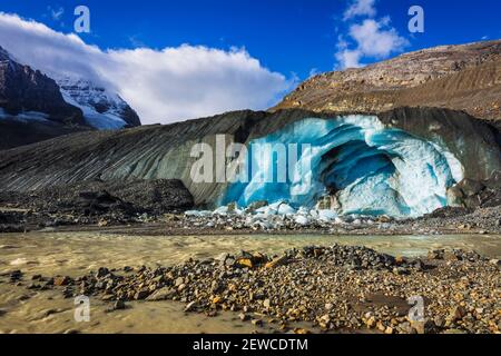 Blue ice and melt water at the toe of the Athabasca Glacier, Jasper National Park, Alberta, Canada Stock Photo