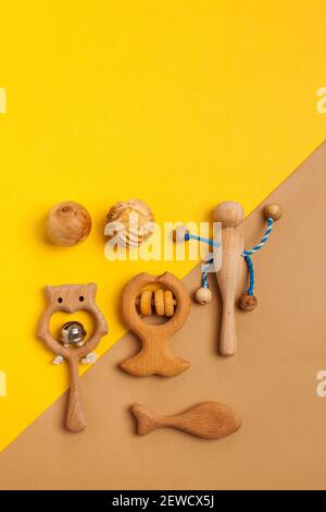 Children's wooden toys, rattles and teethers. Copy space. Stock Photo