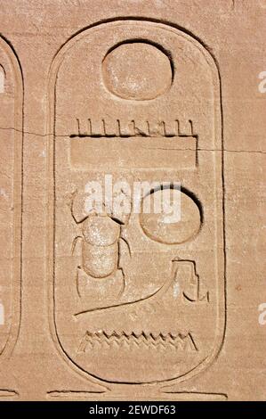 Ancient Egyptian cartouche carving with a sacred scarab beetle. Temple of Karnak, LUxor, Egypt Stock Photo