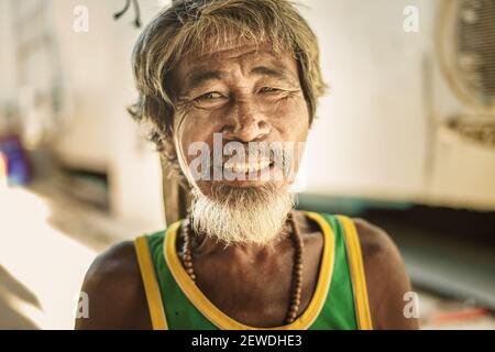 Old man in Urak Lawoi sea gypsy village on Koh Lipe island, Thailand Stock Photo